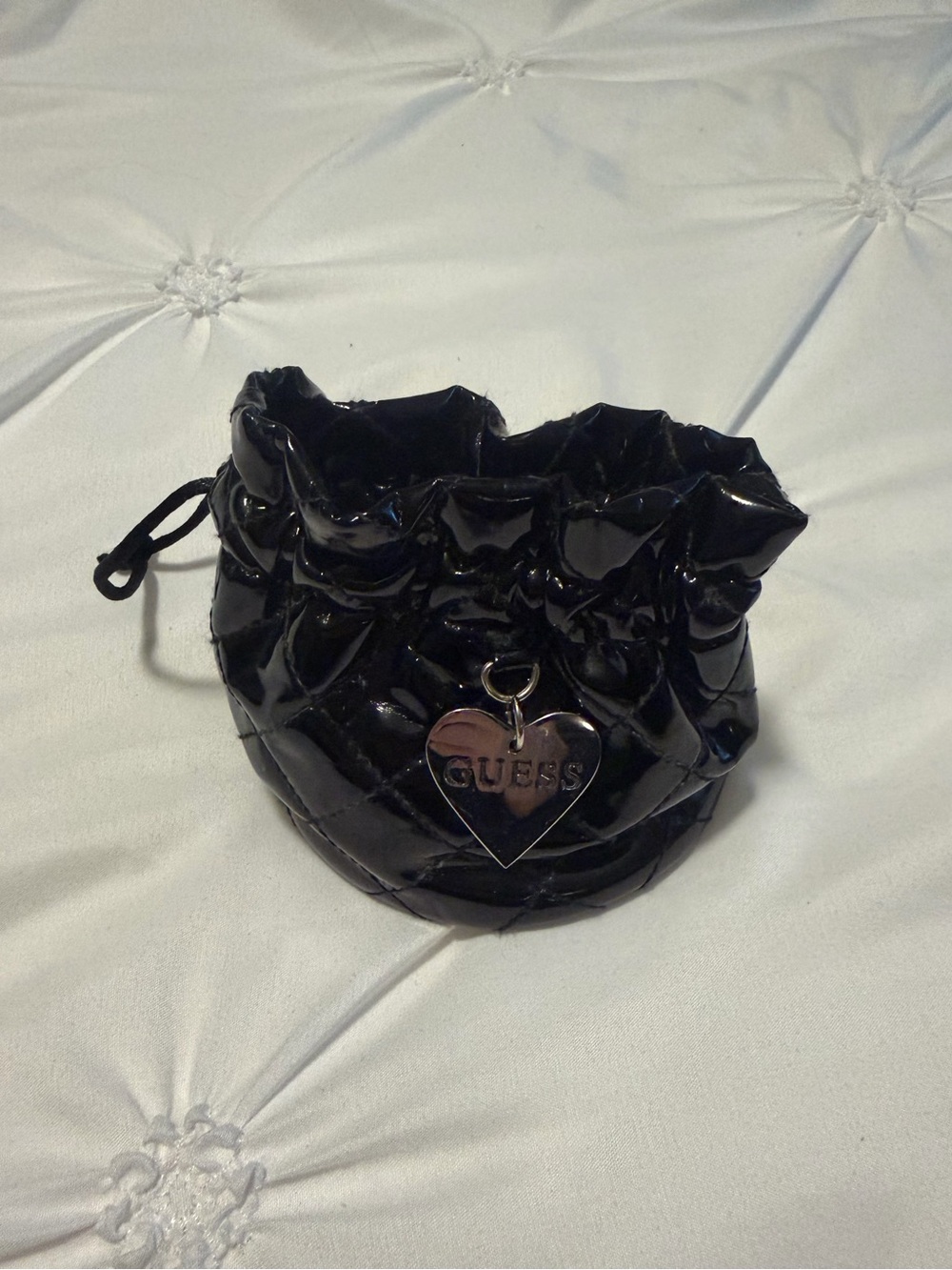 drawstring Guess pouch with heart guess charm